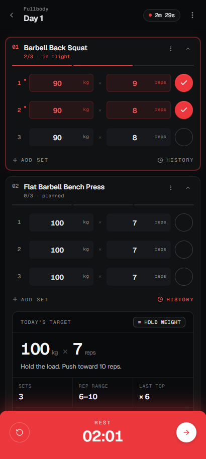 Session screen mid-workout with sets logged and the rest timer running